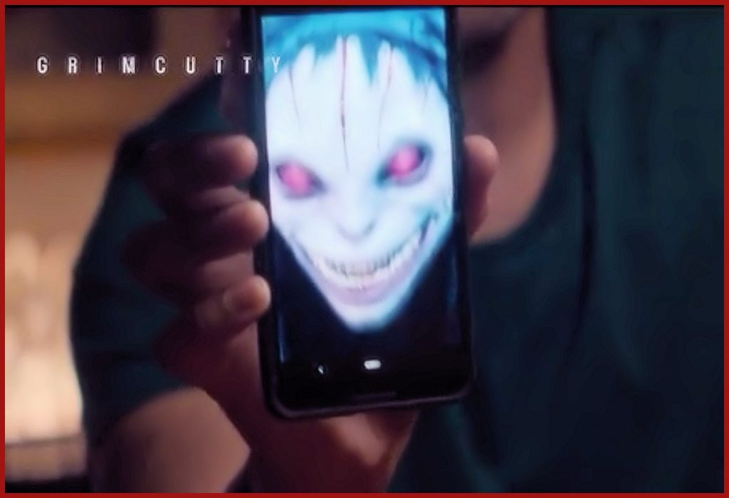 A picture of the Grimcutty internet meme monster on a cell phone