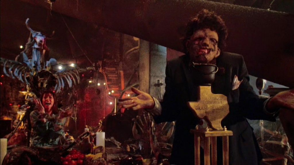 The Texas Chainsaw Massacre 2 a scene on leatherface standing in front of captives